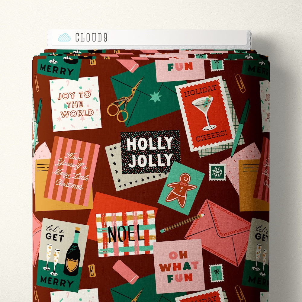 Collage of Christmas-themed cards and envelopes on a burgundy background