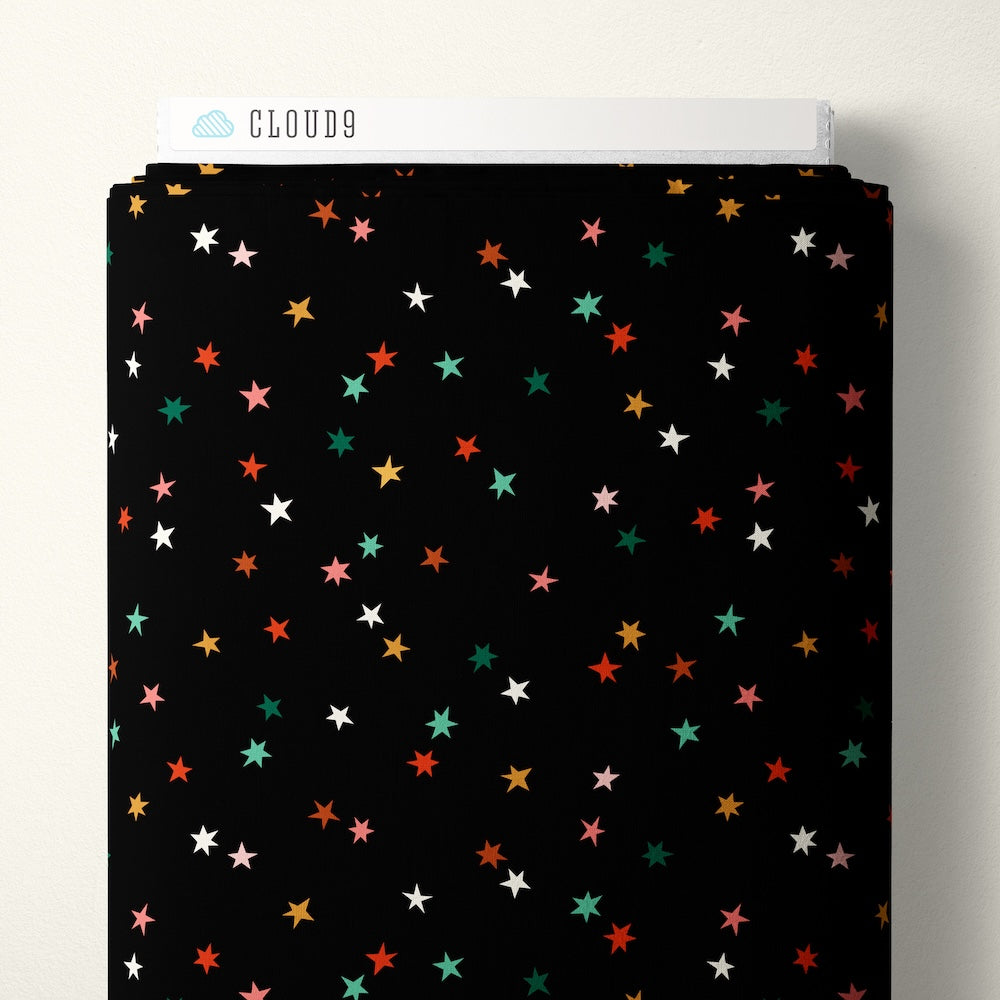 Pattern of colorful stars on a black background