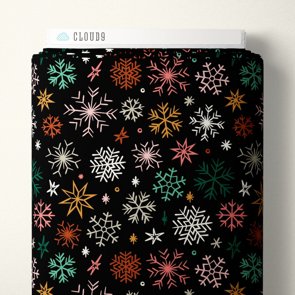 Colorful snowflake pattern on a black background
