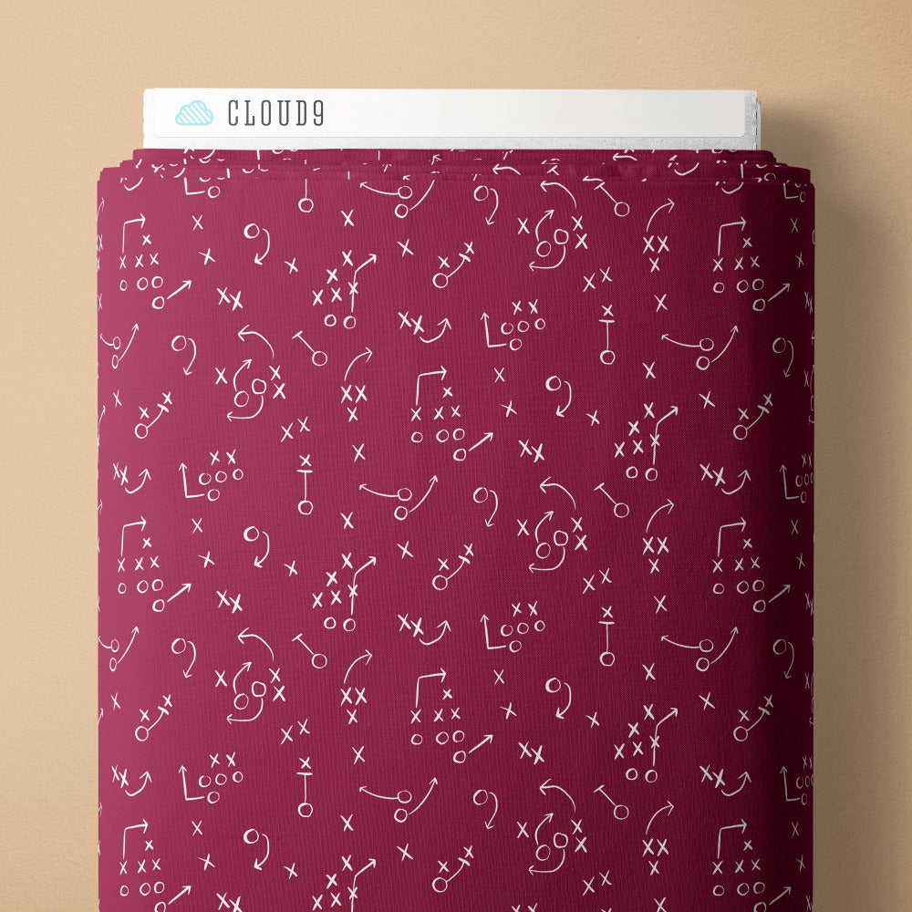 White football play diagrams on a red-purple background