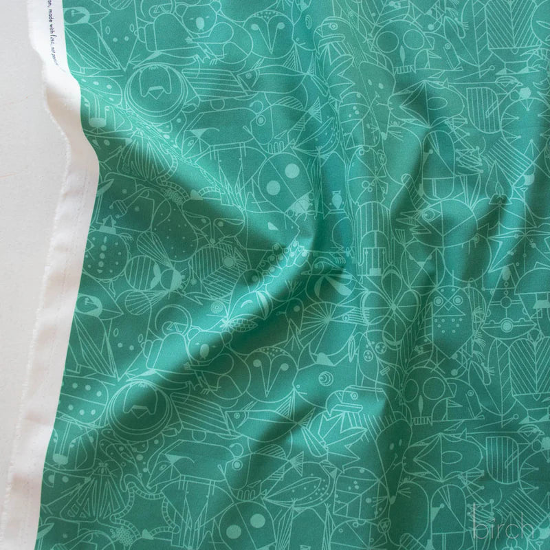 Patterned fabric with geometric animal illustrations in green on a teal green background