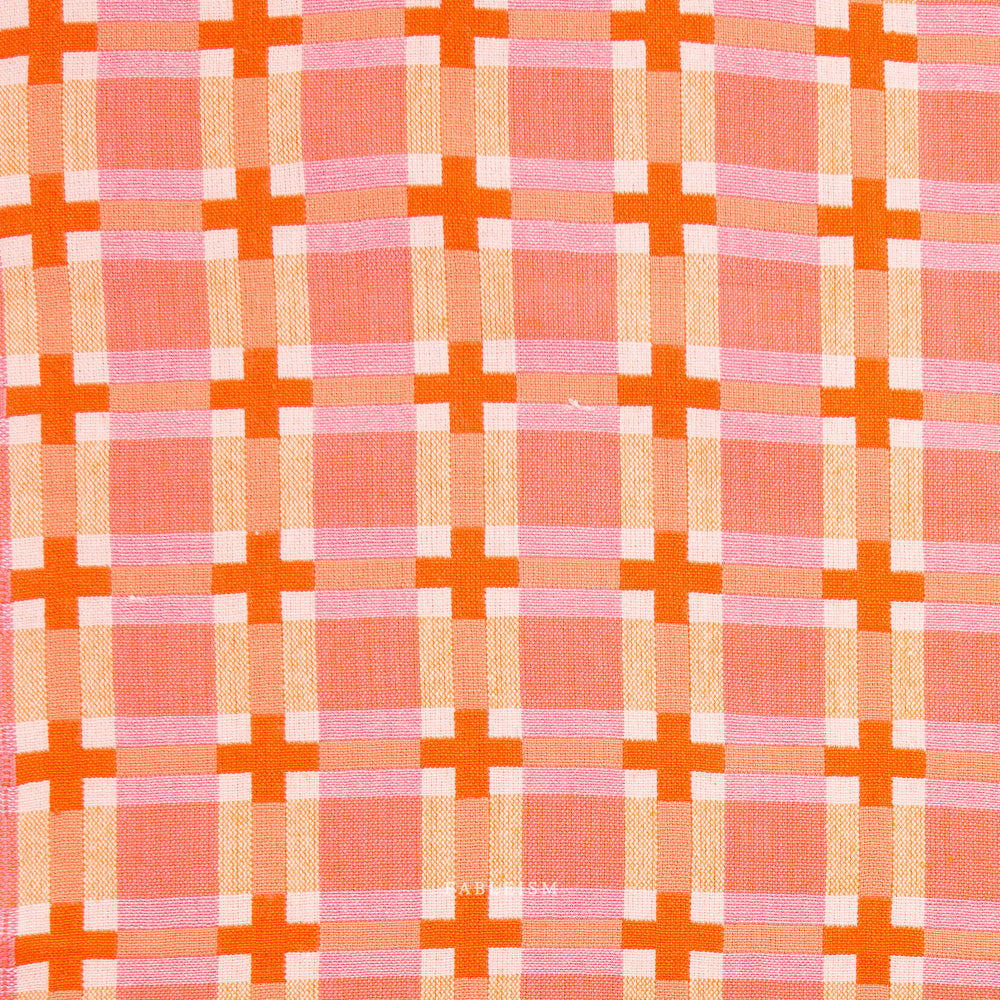 Pink and orange checkered fabric on a white background