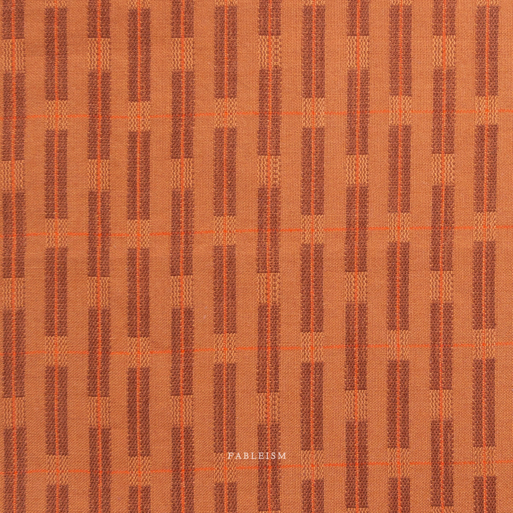 Orange fabric with a subtle pattern on a white background, branded 'Fableism'.