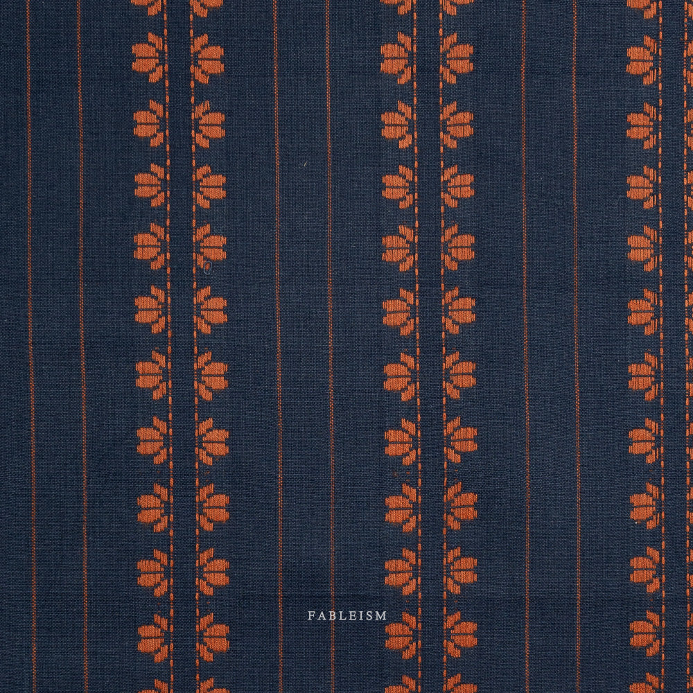 Navy fabric with orange floral stripe pattern, on a white background
