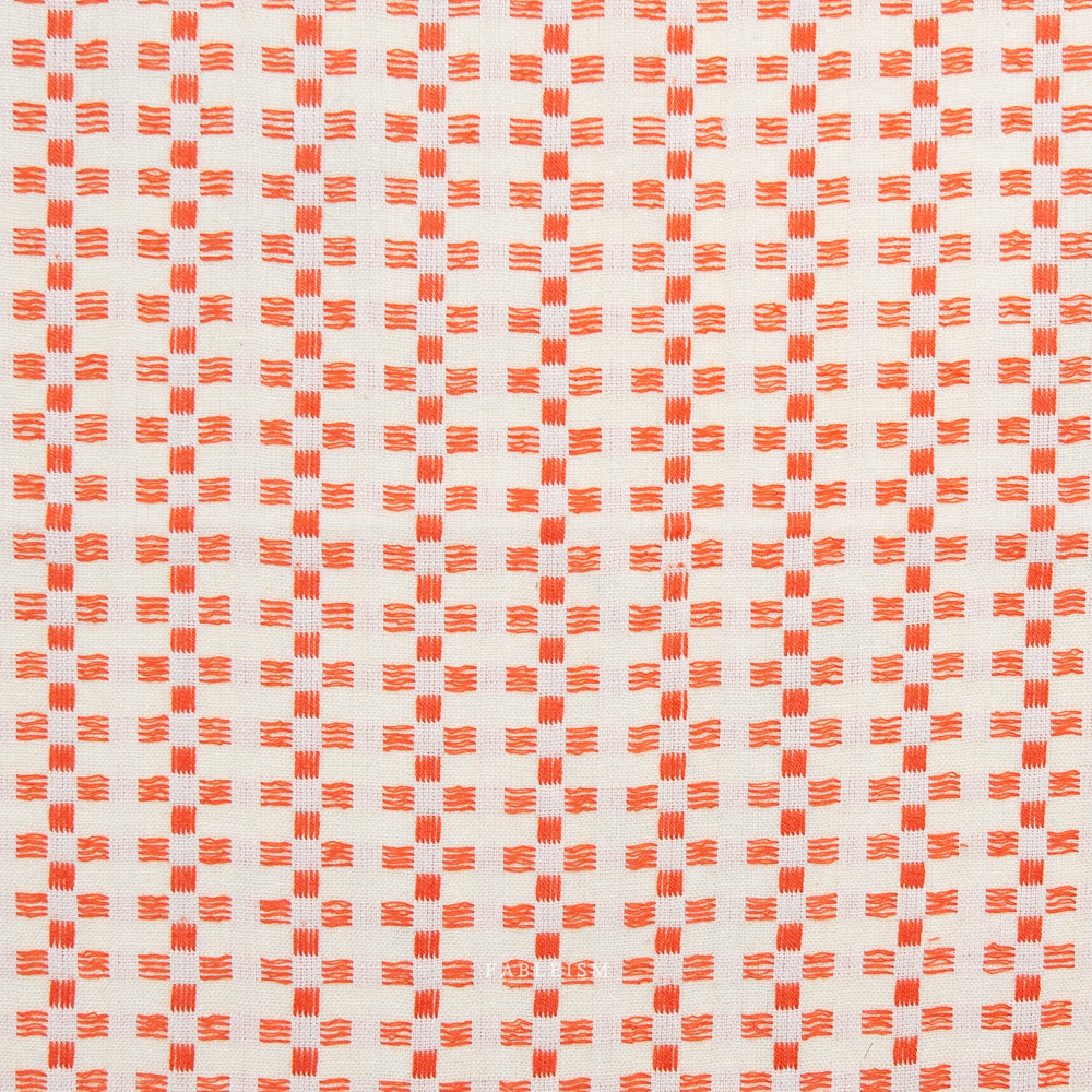 Close-up of orange and white checkered fabric