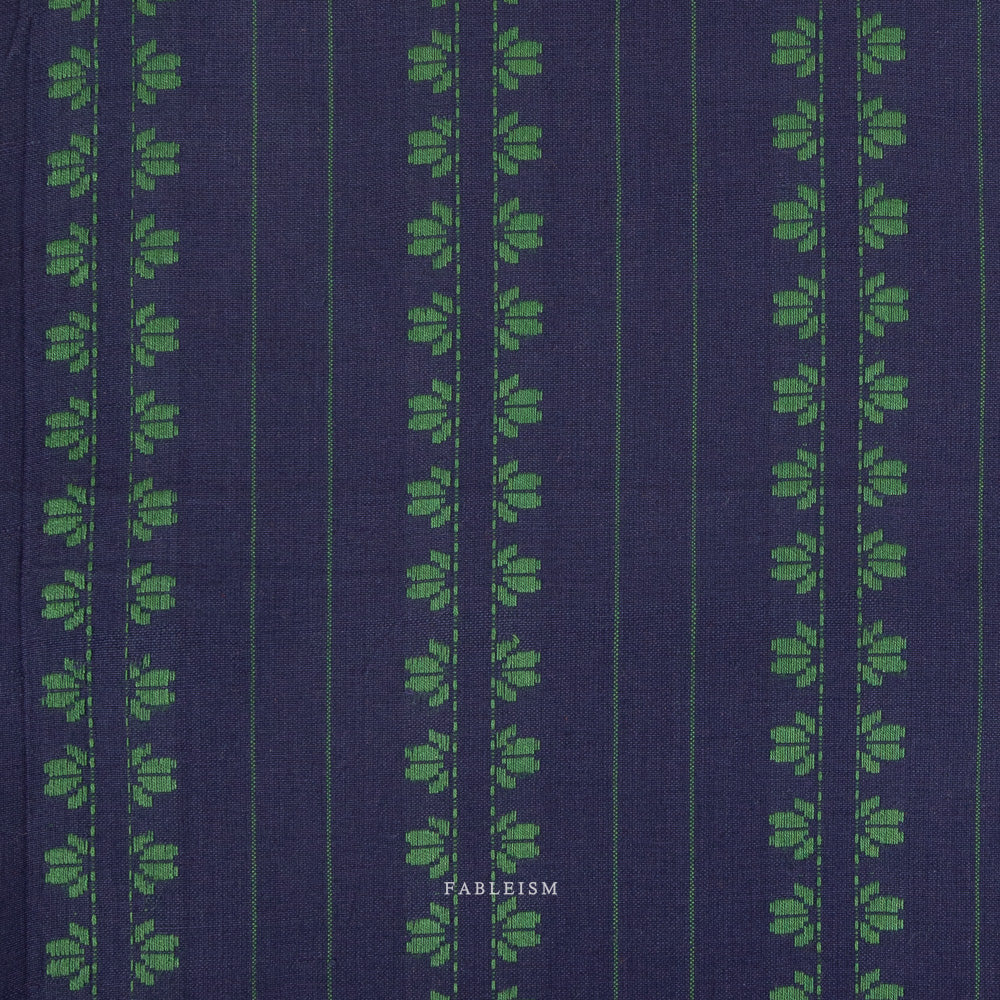 Navy fabric with green leaf striped pattern on a white background