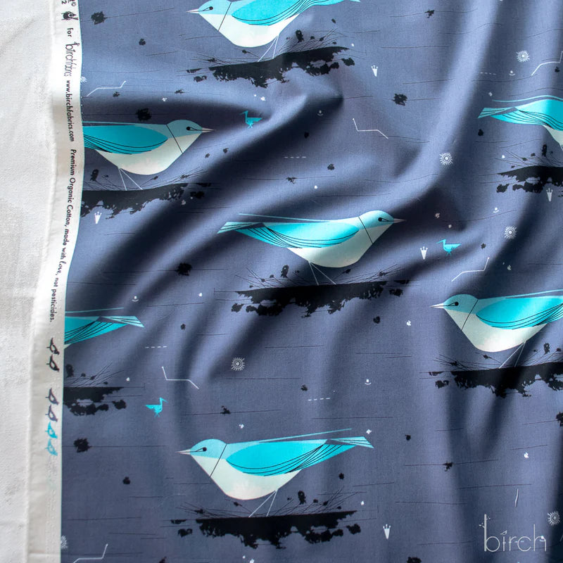 Pattern of blue birds on a gray background..