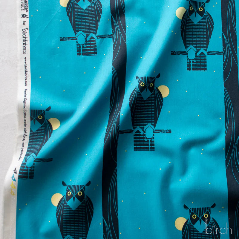 Pattern of owls on a blue background with trees and moon.