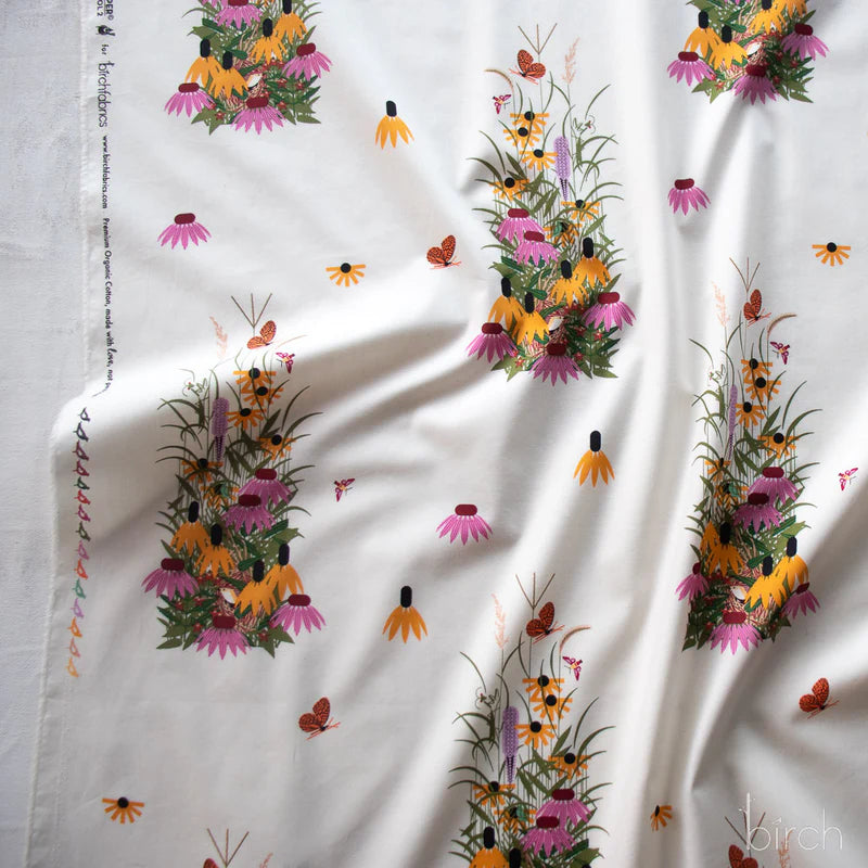 Pattern of colorful flowers and butterflies on a white background