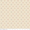 A repeating fabric pattern on a warm cream background with small diamond motifs in muted terracotta, taupe, and light gray. A ruler along the bottom edge shows scale and includes the text 'Riley Blake Designs', indicating the brand.